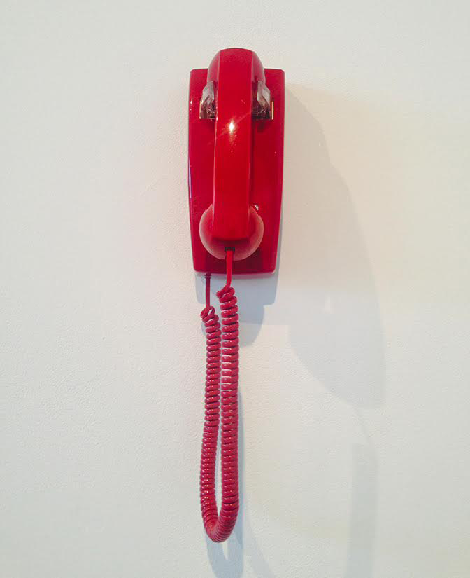 photo of a red wall-hung phone