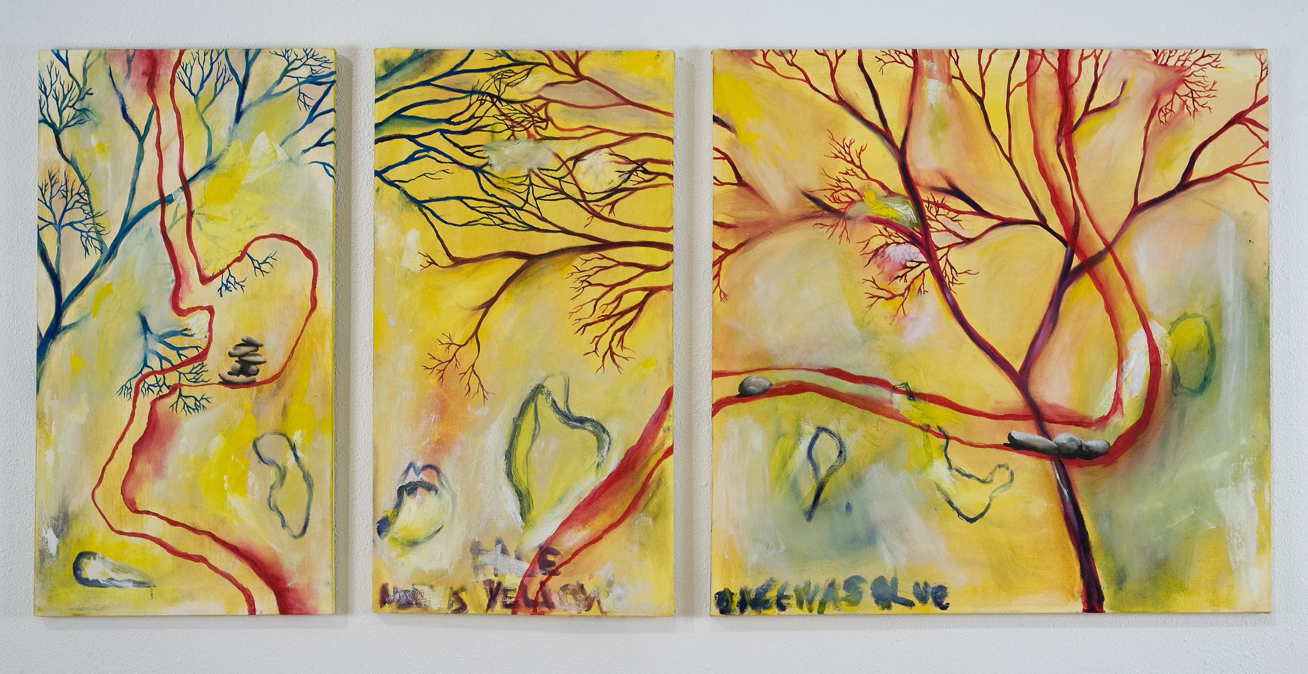 leafless tree limbs stretch across three canvasses