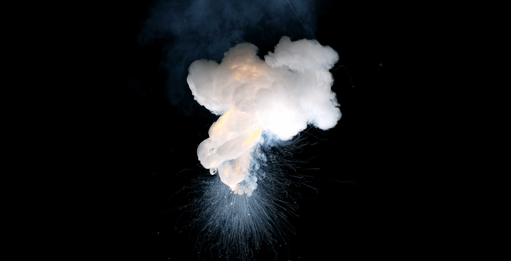 Photo of sparks and a cloud of smoke