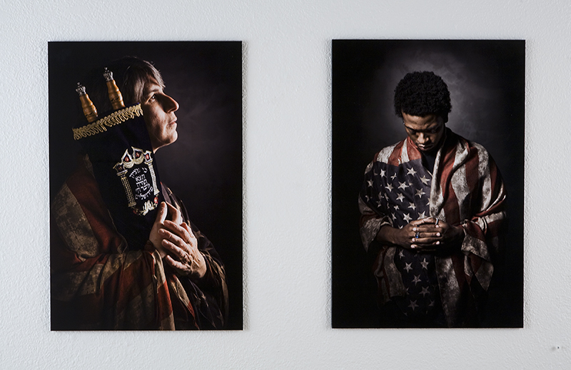 Photos of a cleric and of a man in american flag shirt hanging on the wall