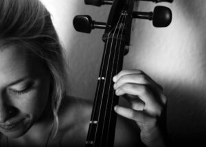 Close up photo of a woman playing cello