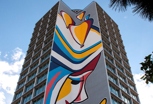 The colorful exterior of the RMCAD Assembly Student Living building