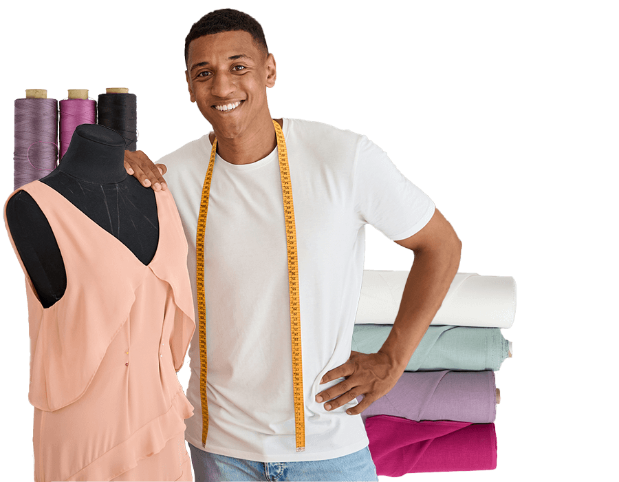 A young fashion designer standing next to his mannequin featuring a blouse he's working on