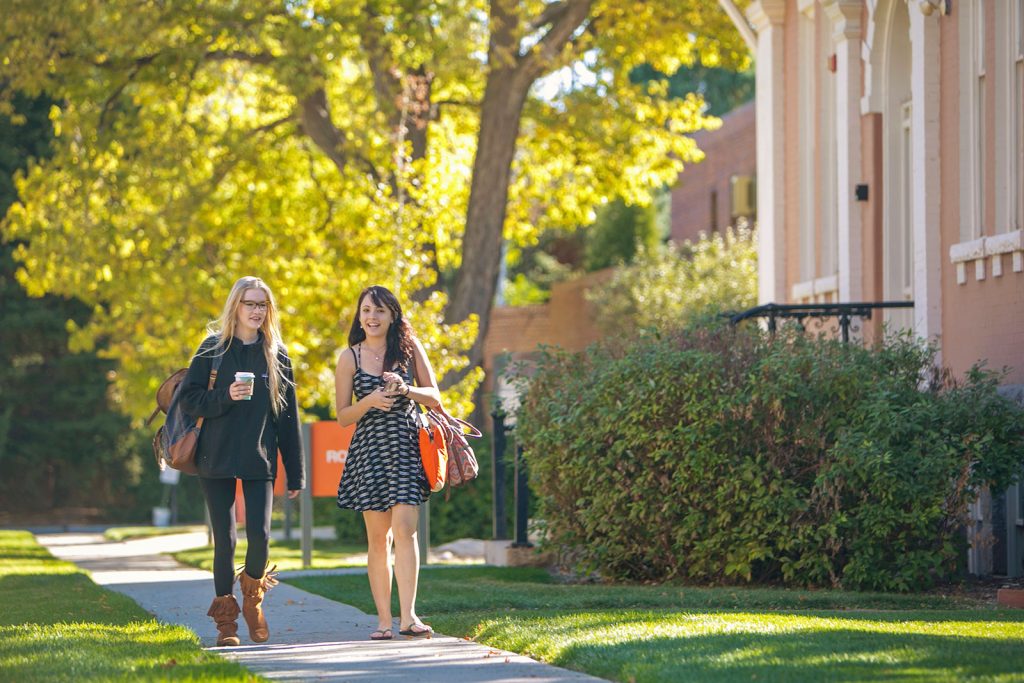 Two RMCAD students walk through campus