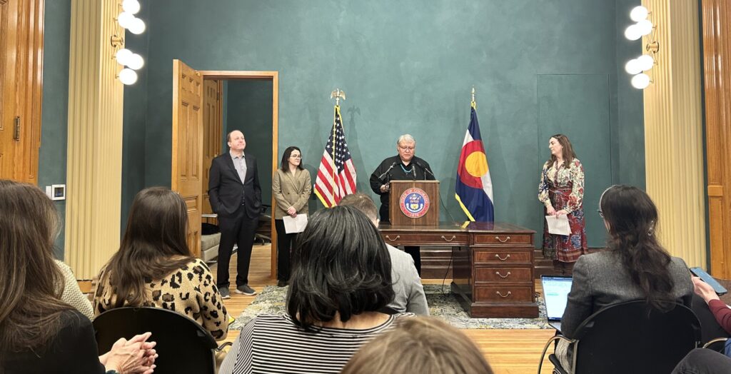Crisosto Apache accepting the honor of Poet Laureate.