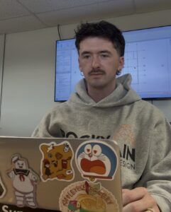 Nathan Simon working at computer.