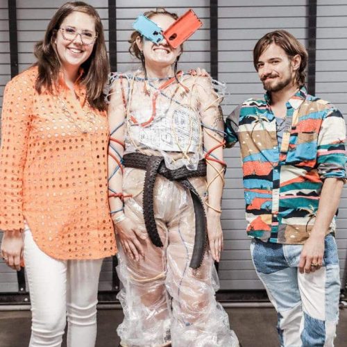 RMCAD students Ann Moorman and Grayson Nite posing with their model